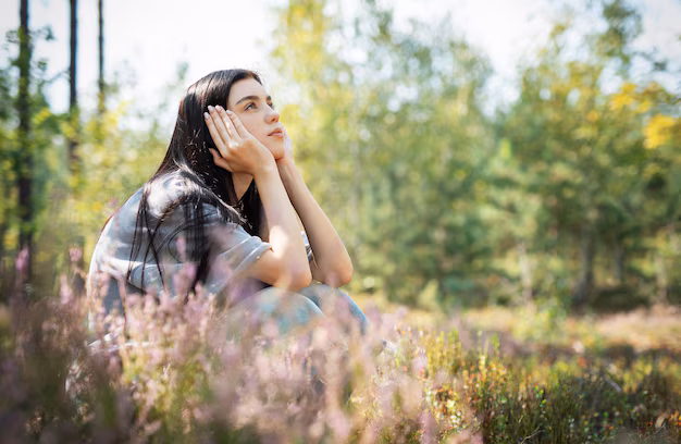 Person reflecting peacefully in nature